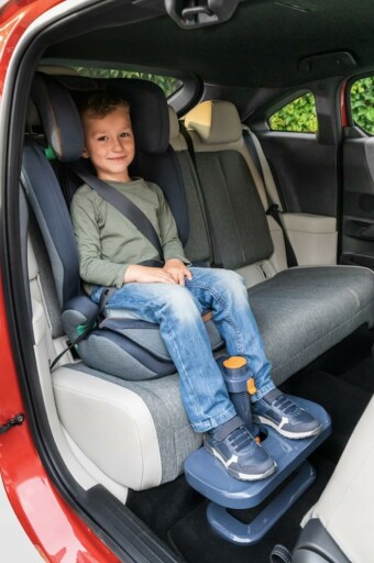 Car Foot Rest for Children and Babies in use with a toddler booster seat