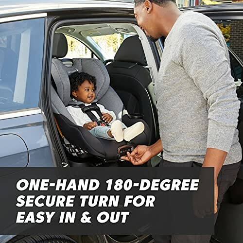 Adult adjusting child in a car seat with one-hand 180-degree rotation feature.