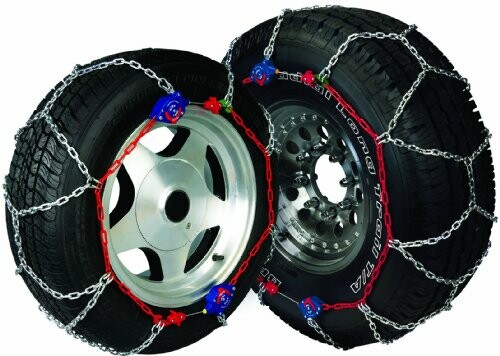 Two car tires with snow chains